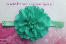 Smalle groen/goud gestippeld baby haarbandje met kanten bloem.