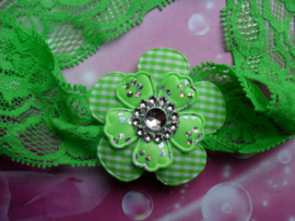 Kanten groene baby haarband met bloem.