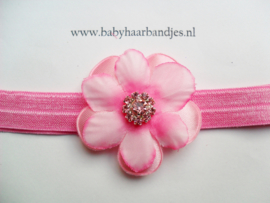 Smalle donker roze baby haarband met bloemen.