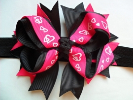 Smalle zwarte baby haarband met grote boutique bow.