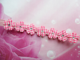 Voor de allerkleinste super smal roze haarbandje met mini bloemetjes.