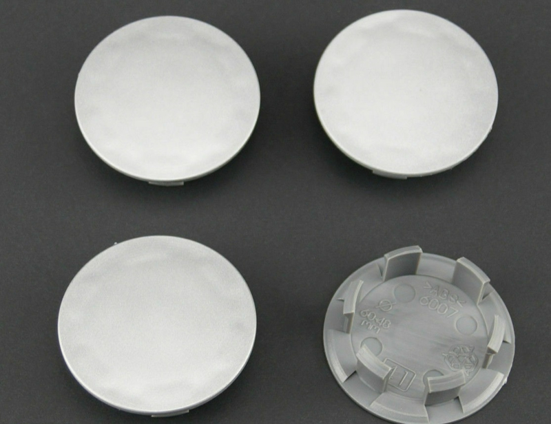 Set van 4 zilvergrijze naafdoppen, buitenmaat 59,5 mm en klemmaat 47 mm