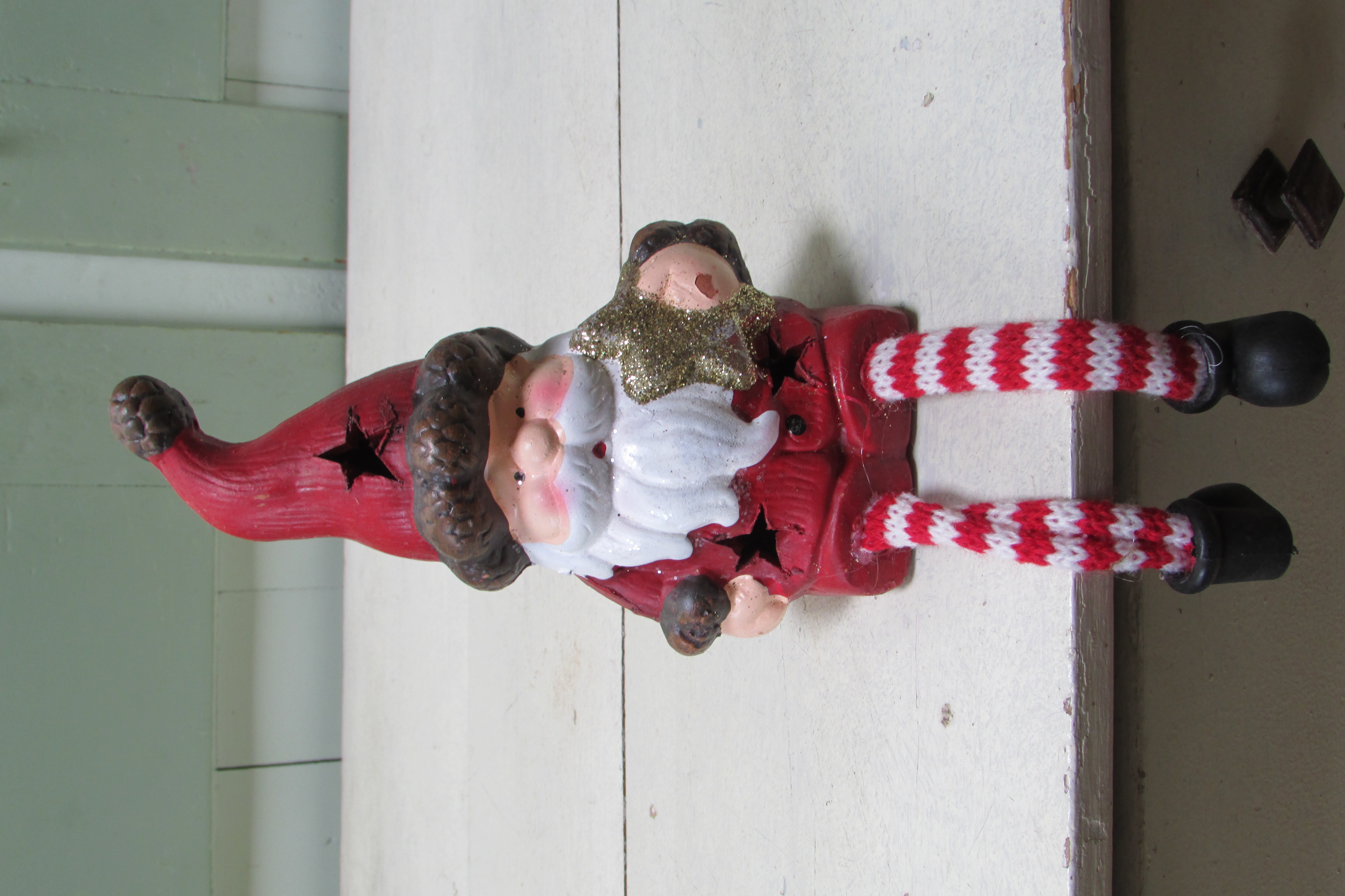 Kerstman met bungelbeentjes en ster (beschadigd)
