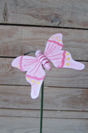 Vlinder op steker roze