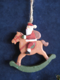 Kerstman op hobbelpaard