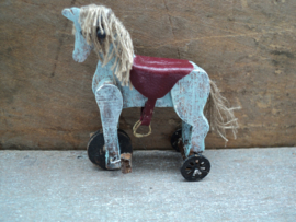 Dollhouse miniaiture toy horse on wheels