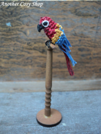 Dollhouse miniature parrot on a stick in one inch scale