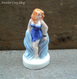 Statue pin up girl in short blue dress