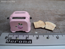 Dollhouse miniature toaster with two pieces of toast in 1" scale