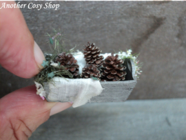 Dollhouse miniature box with pine cones in one inch scale