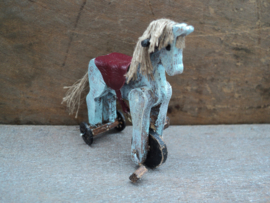 Dollhouse miniaiture toy horse on wheels