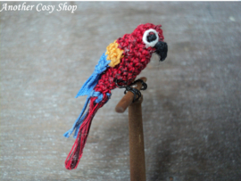 Dollhouse miniature parrot on a stick in one inch scale