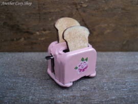 Dollhouse miniature toaster with two pieces of toast in 1" scale