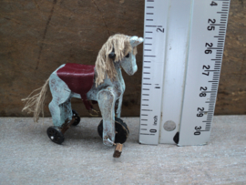 Dollhouse miniaiture toy horse on wheels