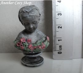 Dollhouse miniature bust of a girl with a headscarf