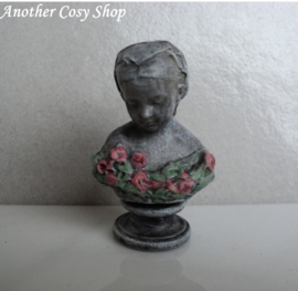 Dollhouse miniature bust of a girl with a headscarf