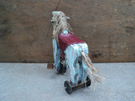 Dollhouse miniaiture toy horse on wheels