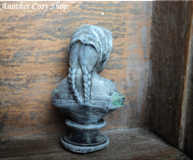 Dollhouse miniature bust of a girl with a headscarf