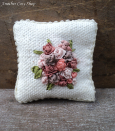 Pillow with multicolored roses