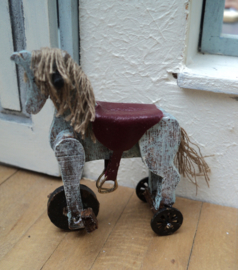 Dollhouse miniaiture toy horse on wheels