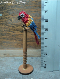 Dollhouse miniature parrot on a stick in one inch scale