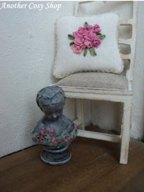 Dollhouse miniature bust of a girl with a headscarf