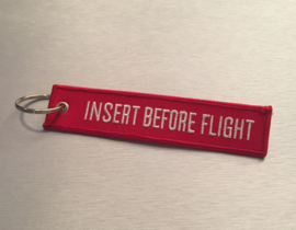 Insert Before Flight Sleutelhanger Rood