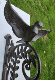 BEL MET VOGEL MET UITSLAANDE VLEUGELS
