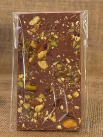 Thin milk chocolate bar with crushed pistachio
