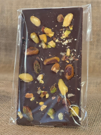Thin dark chocolate bar with crushed pistachio
