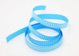 10.05 Licht blauw lint met wit gekartelde opdruk
