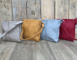 Kleine gele bag in bag tas met siernaad