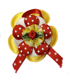 Corsage bloem Oeteldonkse kleuren rood wit geel sterretjes lint