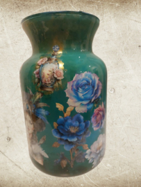Groene vaas met honden en bloemen.