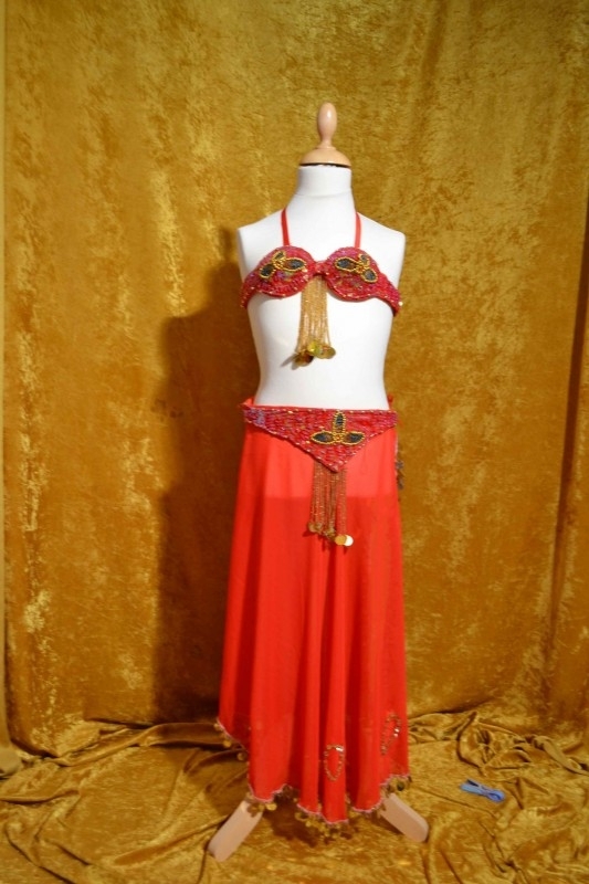 Kostuum fuchsia-rood/goud