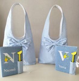 Dames/ meisjes schoudertas licht blauw/ wit streep met strik katoen