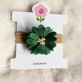 Haarbandje met groene bloem