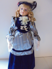 pop emely 70 cm !! met porselein hoofd &handen en voeten prijs per stuk
