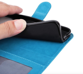 PU BoekCover Hoes Etui voor Apple iPhone 17 -   Turquoise  -  Bloem-Motief in Reliëf
