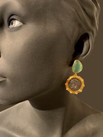 Cateye en romeinse munt