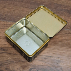 Vintage decoratief blikje met een vogelmotief