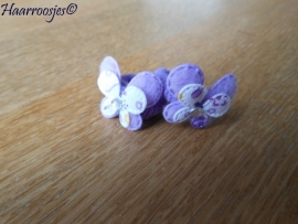 Zachte elastiekjes, klein, paars met paarse vlinders.
