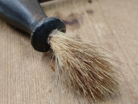 Oude kurkentrekker met kwastje