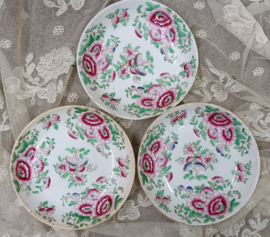 Oude mini kopjes met schoteltjes