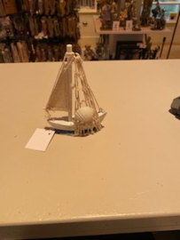 Visserbootje met schelp