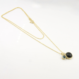 AM 127 Collier London blue topaz en matte onyx. 18kt GG