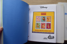 ALBUM MET VERSCHILLENDE DISNEY ZEGELS EN BLOKKEN