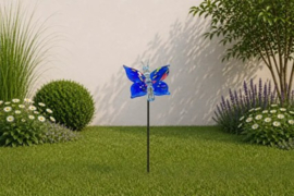 Blauwe vlinder op stok, glas
