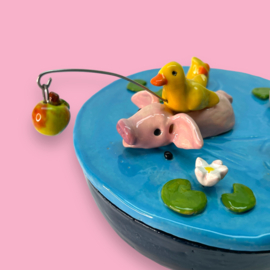 Koektrommel zwemmend varkentje
