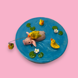 Koektrommel zwemmend varkentje